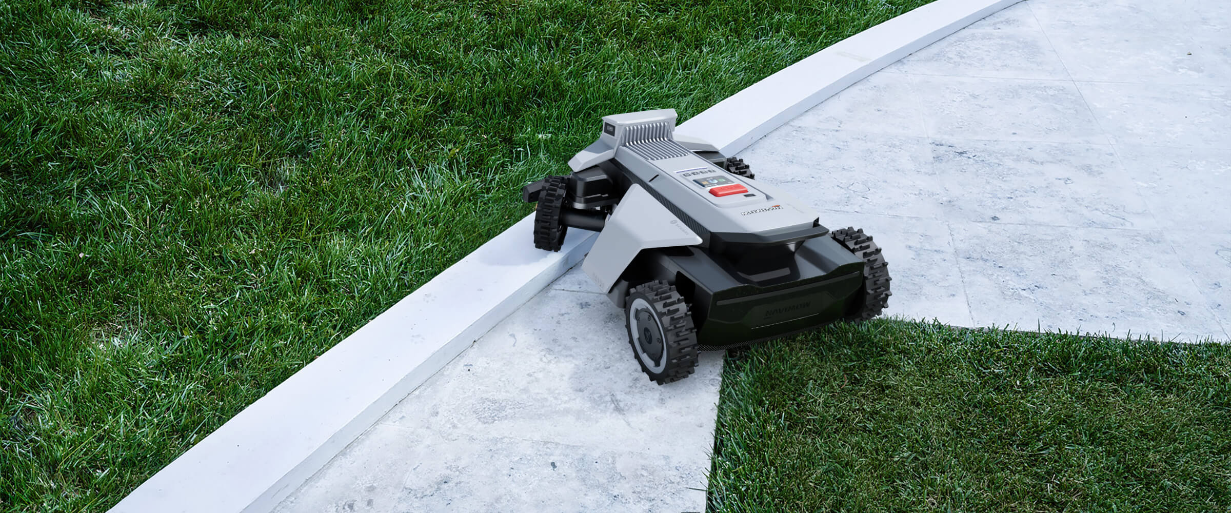 Segway Navimow i105E robotmaaier rijdt over een wit stenen pad.